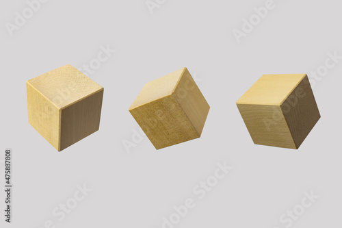 Business concept - abstract geometric real floating wooden cube on grey background.