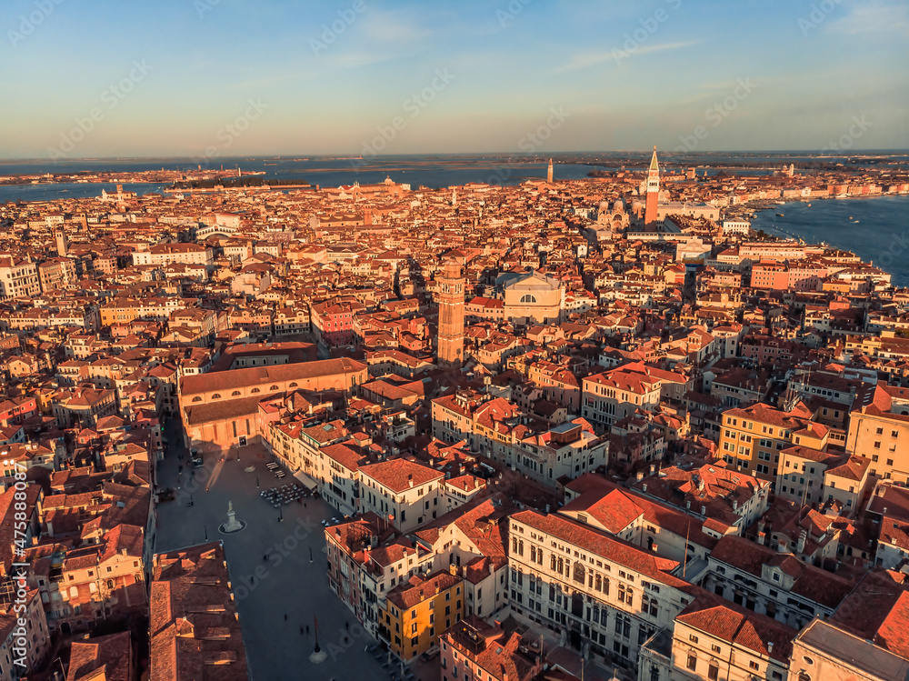 Aerial view of a busy square at sunset near Venice. Panorama of the city from a drone overlooking the lagoon of the Adriatic Sea in northern Italy. Islands of Venice in the background.