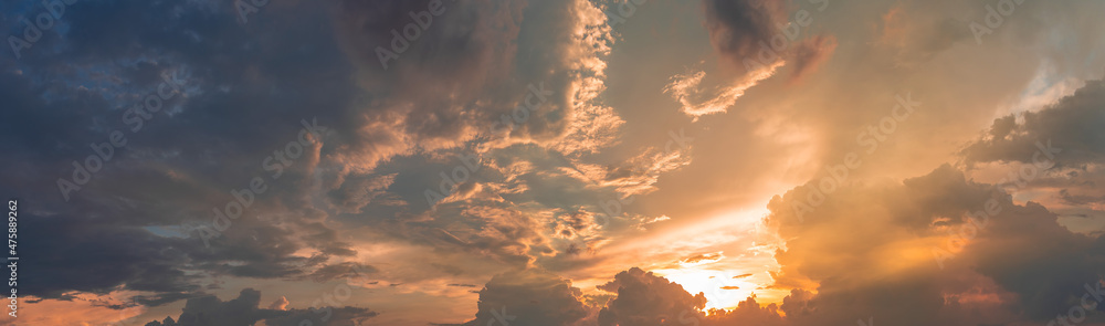 Naklejka premium Beautiful view of sky with clouds at sunrise. Partly cloudy. Colorful sunset. Natural blue sky background texture, beautiful color.