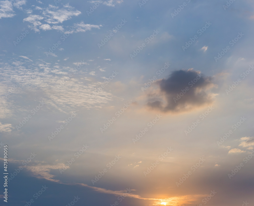 Beautiful view of sky with clouds at sunrise. Partly cloudy. Colorful sunset. Natural blue sky background texture, beautiful color.