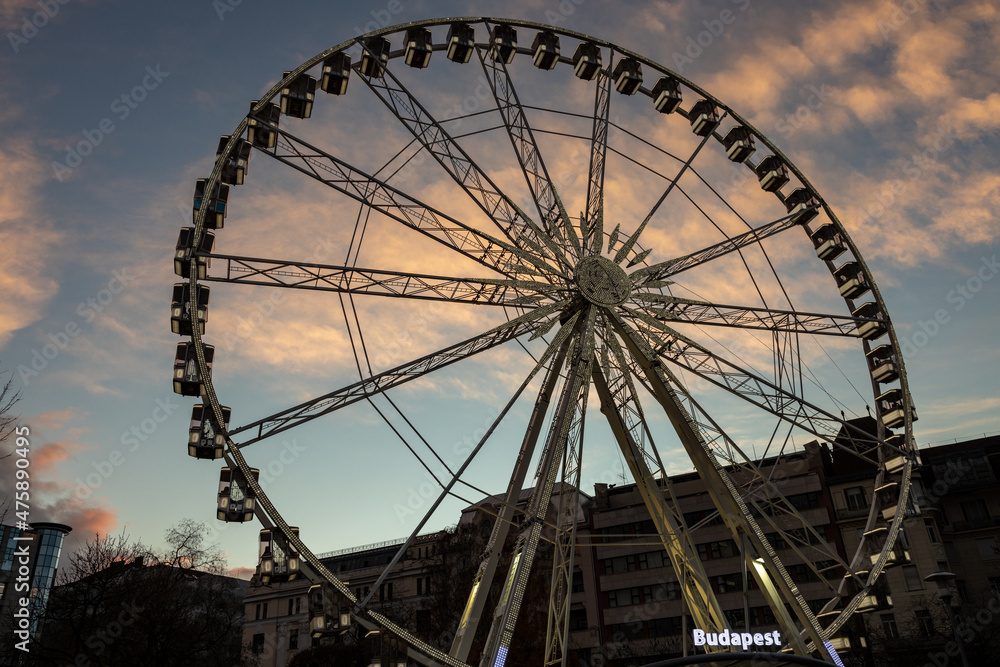 Ferris wheeel in downtow of Budapest at sunset