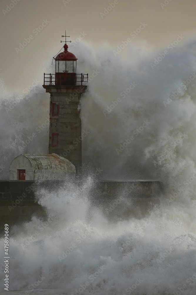 Stormy wave at old lighthouse