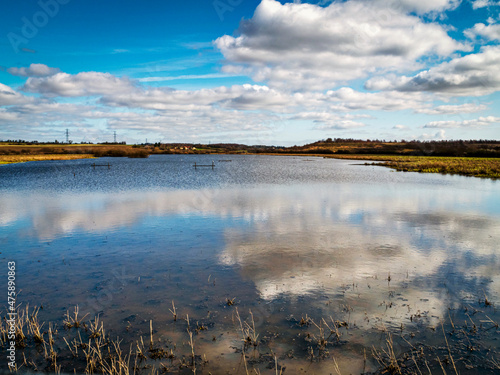 Fototapeta Naklejka Na Ścianę i Meble -  Clouds reflected in wetlands at Fairburn Ings, West Yorkshire, England