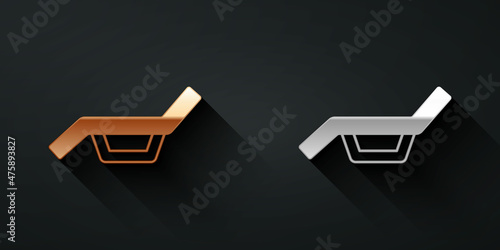 Gold and silver Sunbed icon isolated on black background. Sun lounger. Long shadow style. Vector