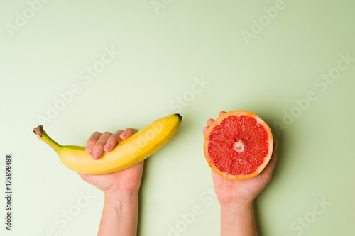 Canvas-taulu Caucasian person using fruit for sex education