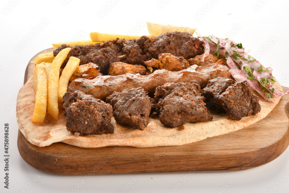 kebab and grilled vegetables isolated on a white background.