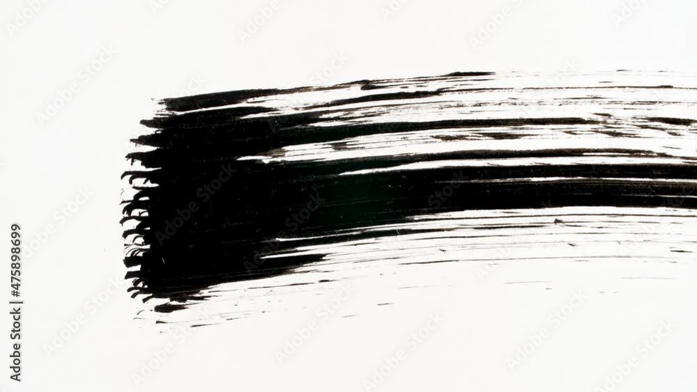 Black mascara swoosh. Macro shot and slow motion of a black mascara isolated on white background. Professional makeup. High quality 4k footage Black mascara swoosh. Macro shot and slow motion of a black mascara isolated on white background. Professional makeup. High quality 4k footage