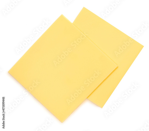 Slices of cheese for burger isolated on white background. Leerdammer Cheese top view.