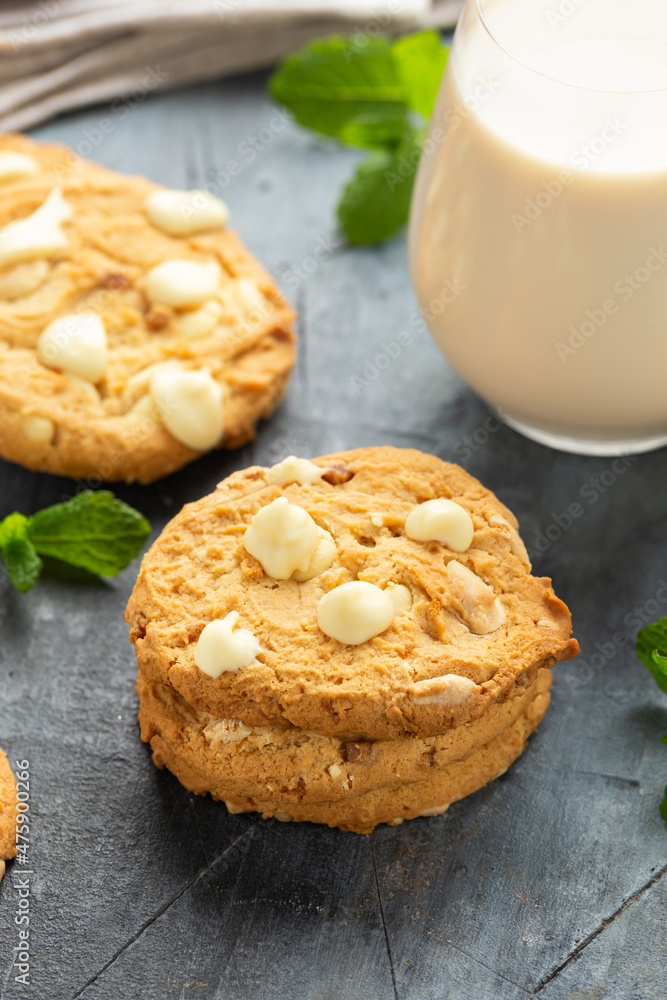 White Chocolate Caramel soft baked cookies served with glass of milk White Chocolate Caramel soft baked cookies served with glass of milk