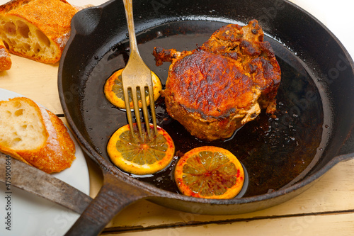 pork chop seared on iron skillet