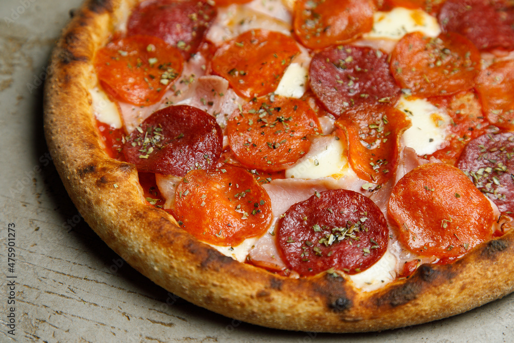 pizza with salami and tomatoes