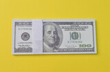 Money banknotes isolated on a yellow background