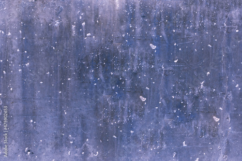bluish-gray colored laminate with cracks and small holes