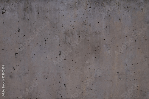 dark grey cement with damage in form of small pinholes