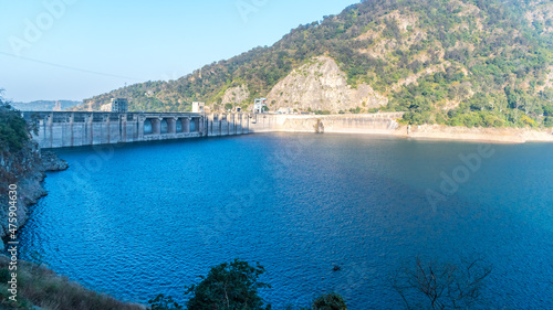 Bhakra Dam is a concrete gravity dam on the Sutlej River in Bilaspur, Himachal Pradesh in northern India. The dam forms the Gobind Sagar reservoir.