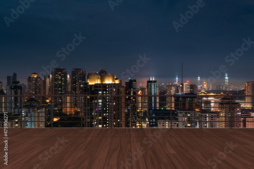 Panoramic Kuala Lumpur skyline view, wooden observatory deck on rooftop, night. Asian corporate and residential lifestyle. Financial city downtown, real estate. Product display mockup empty roof