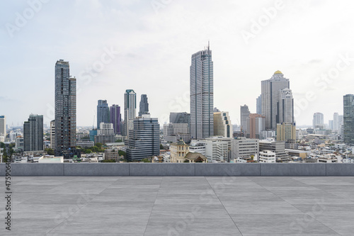 Panoramic Bangkok skyline view, concrete observatory deck on rooftop, daytime. Luxury Asian corporate and residential lifestyle. Financial city downtown, real estate. Product display mockup empty roof © VideoFlow