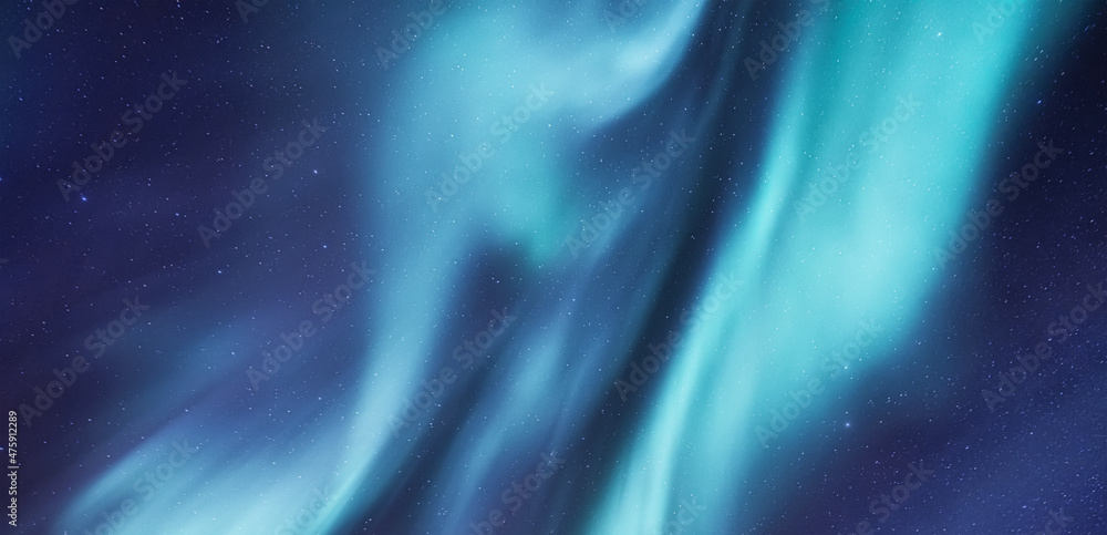 Aurora borealis in Norway. Northern lights as a background. Night winter landscape with aurora.