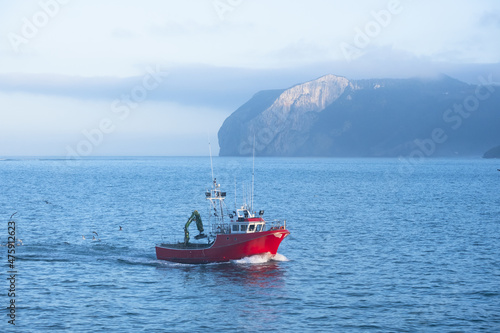 Fishing boat entering Bermeo with the Ogo?o cape in the background, Euskadi