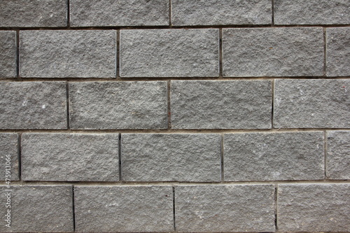Old dry grey brick wall background texture