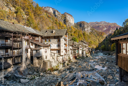 The beautiful village of Rassa, during fall season, in Valsesia (Sesia Valley). Province of Vercelli, Piedmont, Italy. photo