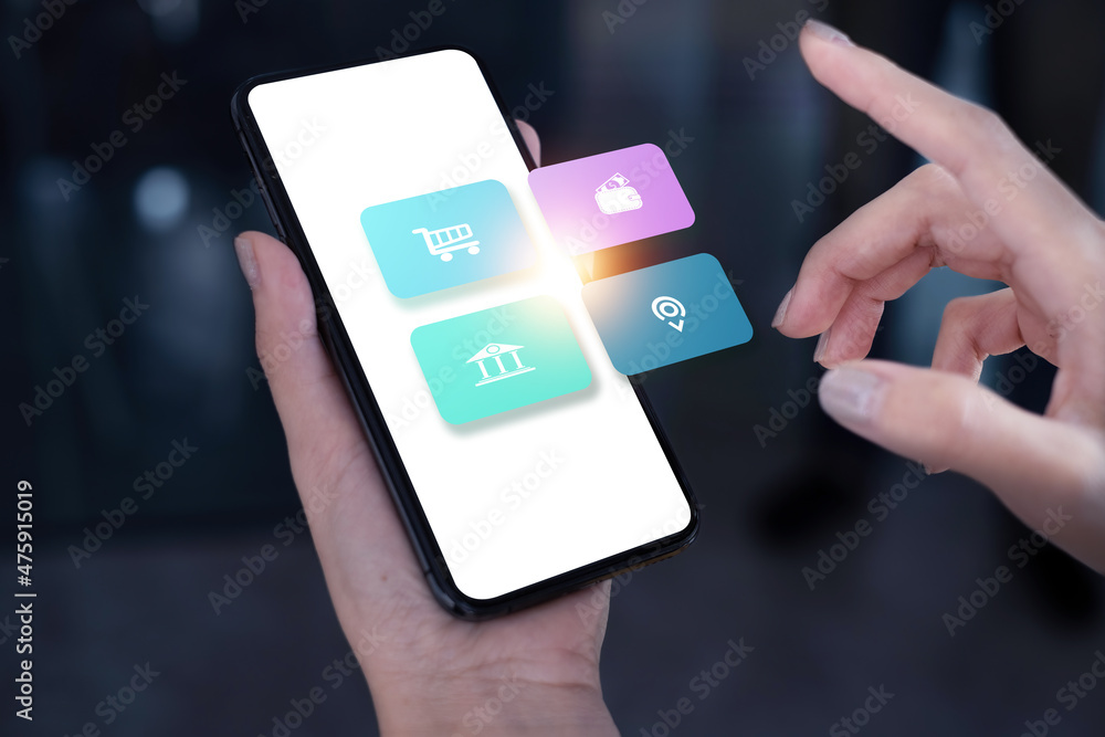 Young freelance using application on smartphone for online shopping or checking stock market. cloud tecnology concept. Young freelance using application on smartphone for online shopping or checking stock market. cloud tecnology concept.