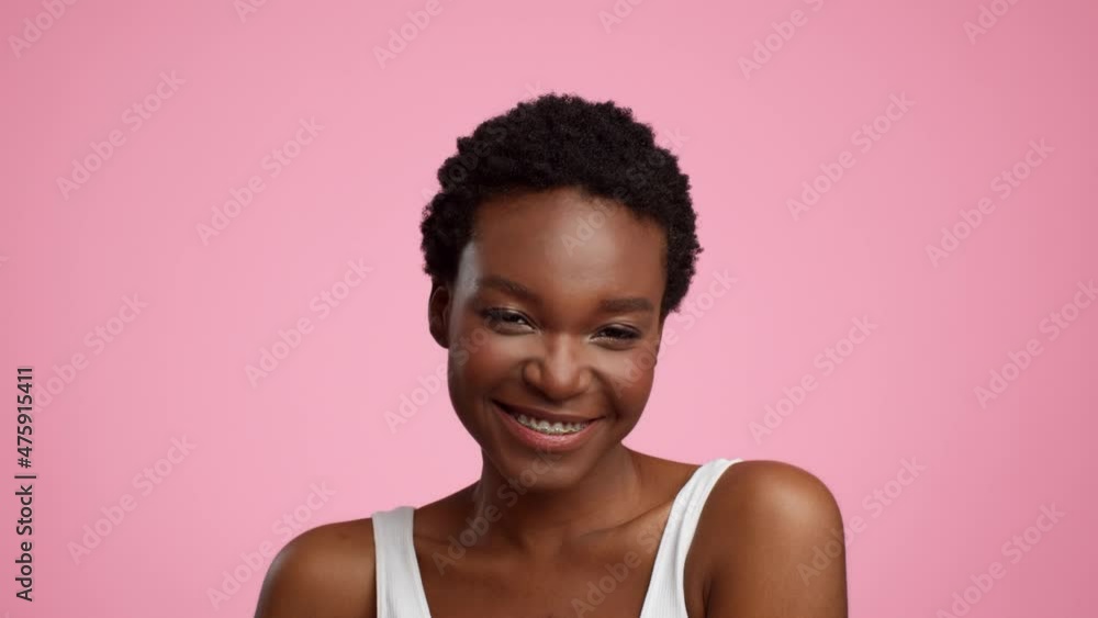Black Woman With Braces Smiling Touching Face Over Pink Background Black Woman With Braces Smiling Touching Face Over Pink Background