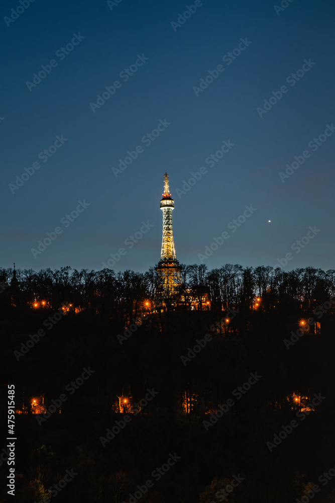 Illuminated Petrin Lookout Tower,Prague,Czech republic.Steel tower 63.5 metres tall on Petrin Hill built in 1891.Observation transmission tower.Major tourist attraction in Czech capital.Night lights