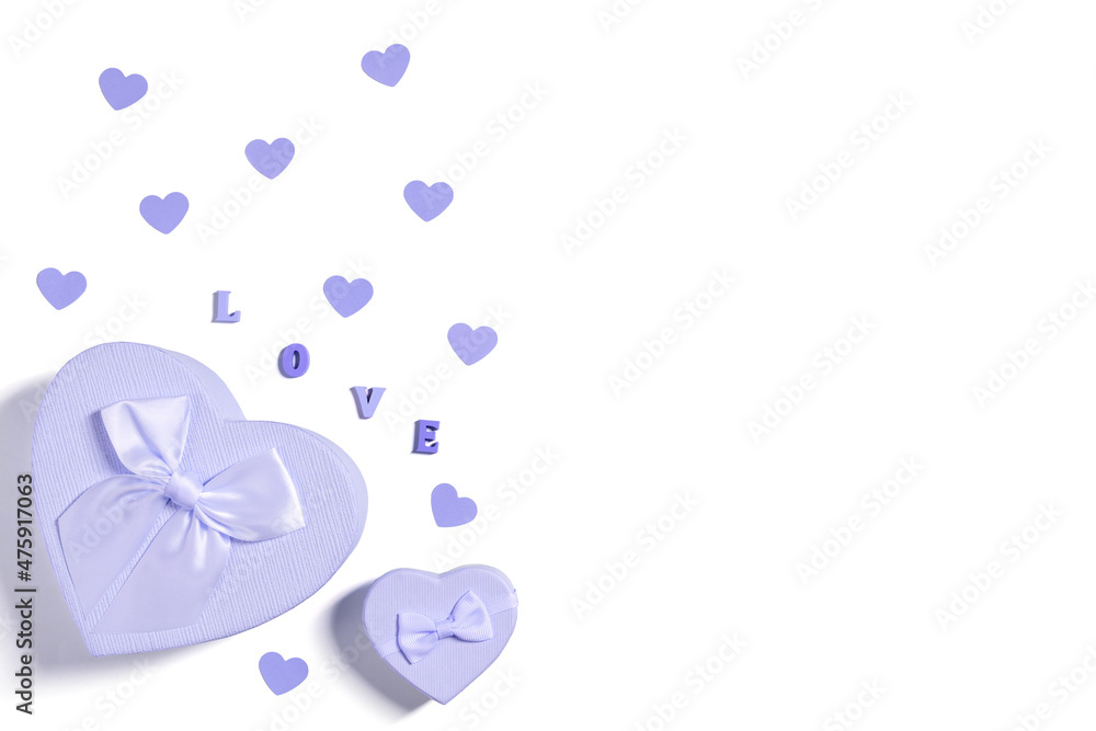 Violet gift boxes and confetti hearts isolated on white background. Color of the year 2022 Very Peri. Valentines day concept. Greeting card. Copy space, top view