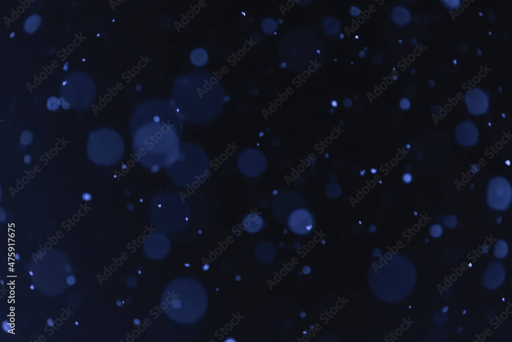 Night snowfall. Round snowflakes on a dark background. Night snowfall. Round snowflakes on a dark background.