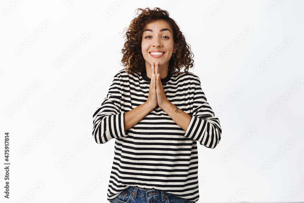 Please. Hopeful cute girl yearning, asking for smth, begging you, standing cute and smiling, white background Please. Hopeful cute girl yearning, asking for smth, begging you, standing cute and smiling, white background
