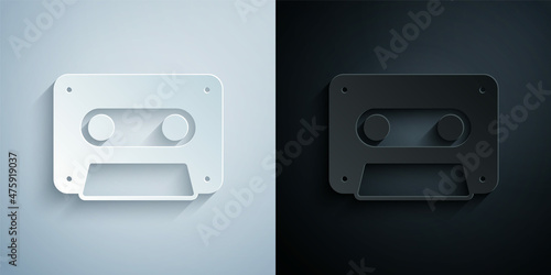 Paper cut Retro audio cassette tape icon isolated on grey and black background. Paper art style. Vector