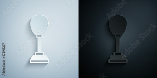 Paper cut Punching bag icon isolated on grey and black background. Paper art style. Vector