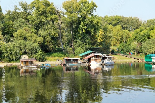  Houses on the water, houseboats, moored to the shore on the Sava river 