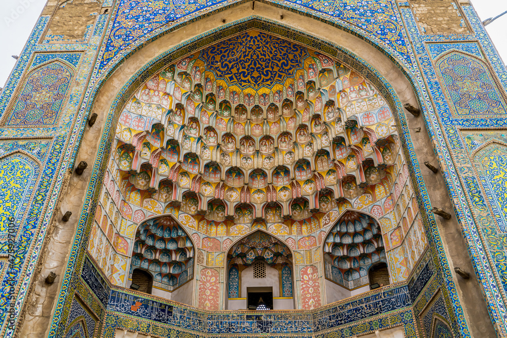 Uzbekistan, city of Bukhara,  rich decorated entrance of the Abdulaziz Khan Madrasah. 