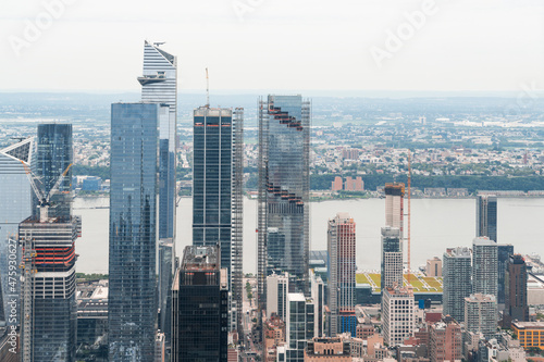 Aerial panoramic city view of West Side Manhattan and Hudson Yards district at day time, NYC, USA. New Jersey on horizon over the Hudson River. A vibrant business neighborhoods. photo