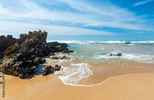 Stone formations on the Aljezur coast in the Algarve, Portugal. Winter time, low tide.