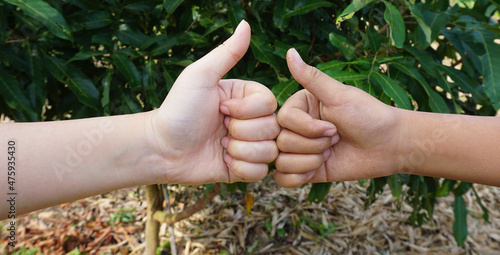 Thumbs up to show success in teamwork.