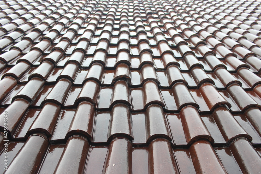 Glossy brown roof tiles. Roof tiles background