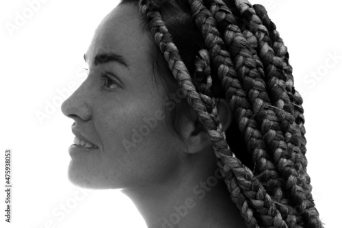 A portrait of a young woman against a white background.