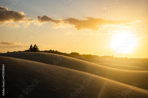 People hanging out in a sand dune on summer