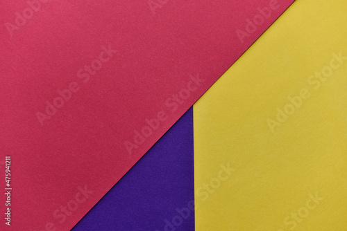 abstract geometric paper background. violet, yellow and red trendy colors. The backdrop for an invitation card, greeting card or web design. Creative copy space, flat lay