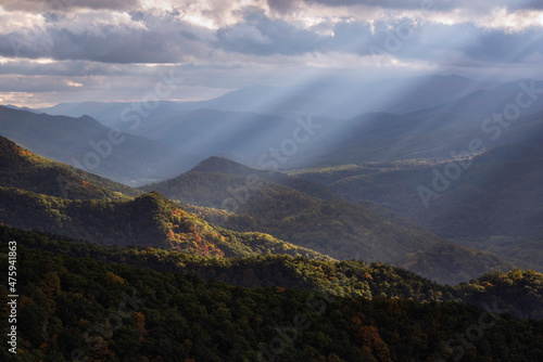 Crepuscular light rays shining across the North Fork Valley in West Virginia, illuminating some of the early Autumn color down below.