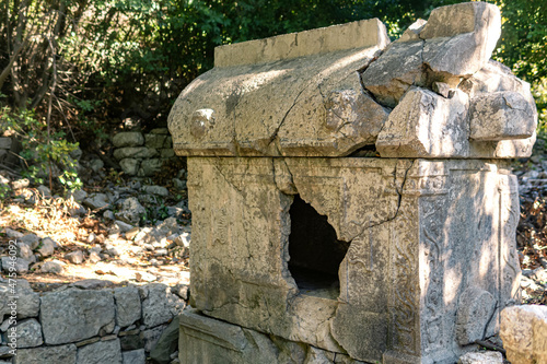 ancient sarcophagus in the ruins of the antique city of Olympos, Turkey photo