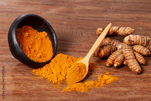 Fresh organic root and turmeric powder - Curcuma longa