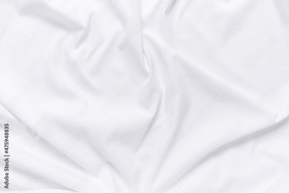 Abstract white fabric texture background. Cloth soft wave. Creases of satin, silk, and cotton.