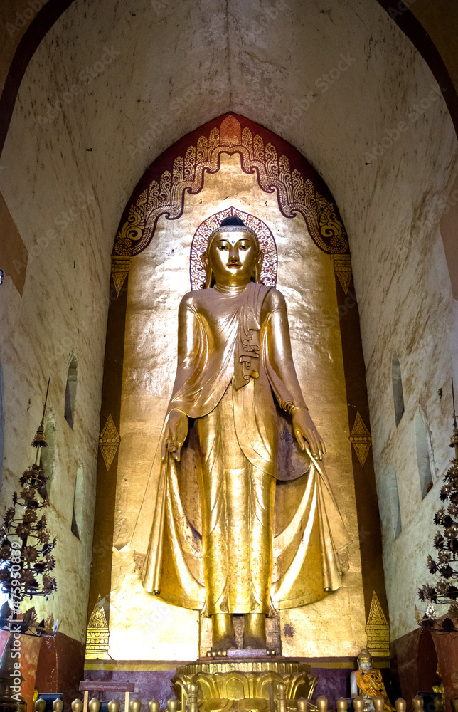 Obraz premium Bagan, Myanmar - view of a golden and beautiful buddha statue inside Ananda Temple