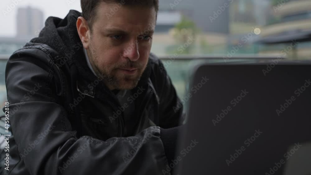 Serious businessman working on laptop in cafe having problems feel worry pensive people having trouble Serious businessman working on laptop in cafe having problems feel worry pensive people having trouble