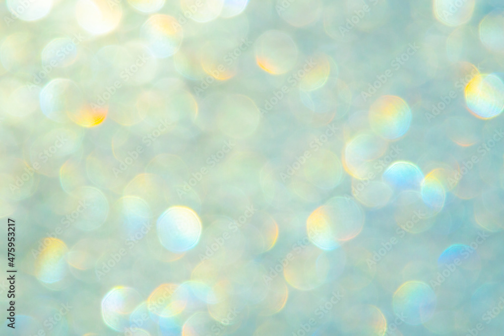 Obraz premium bright glitter background: bokeh effect from many colored lights on frozen glass, toning