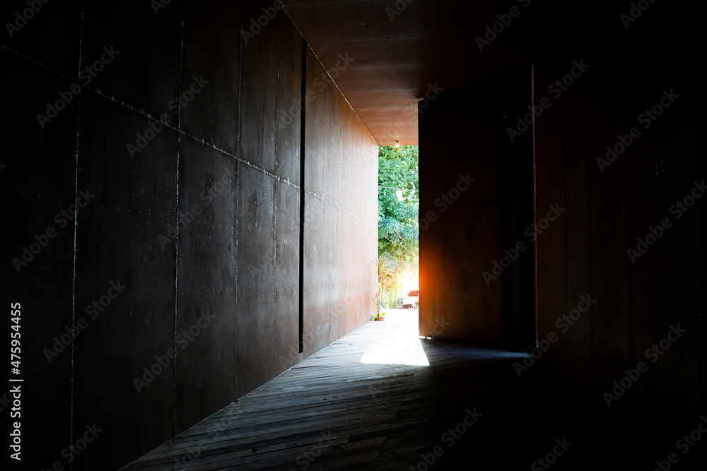 Fototapeta premium Soft focus of Tunnel with steel ceiling and wood wall,sunlight splash lighting through the vent or hole .Light at the end of the tunnel Concept.